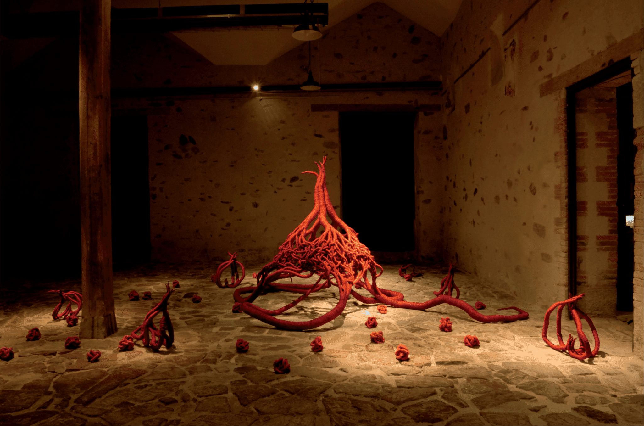 red sculptures by Aude Franjou in a gallery.