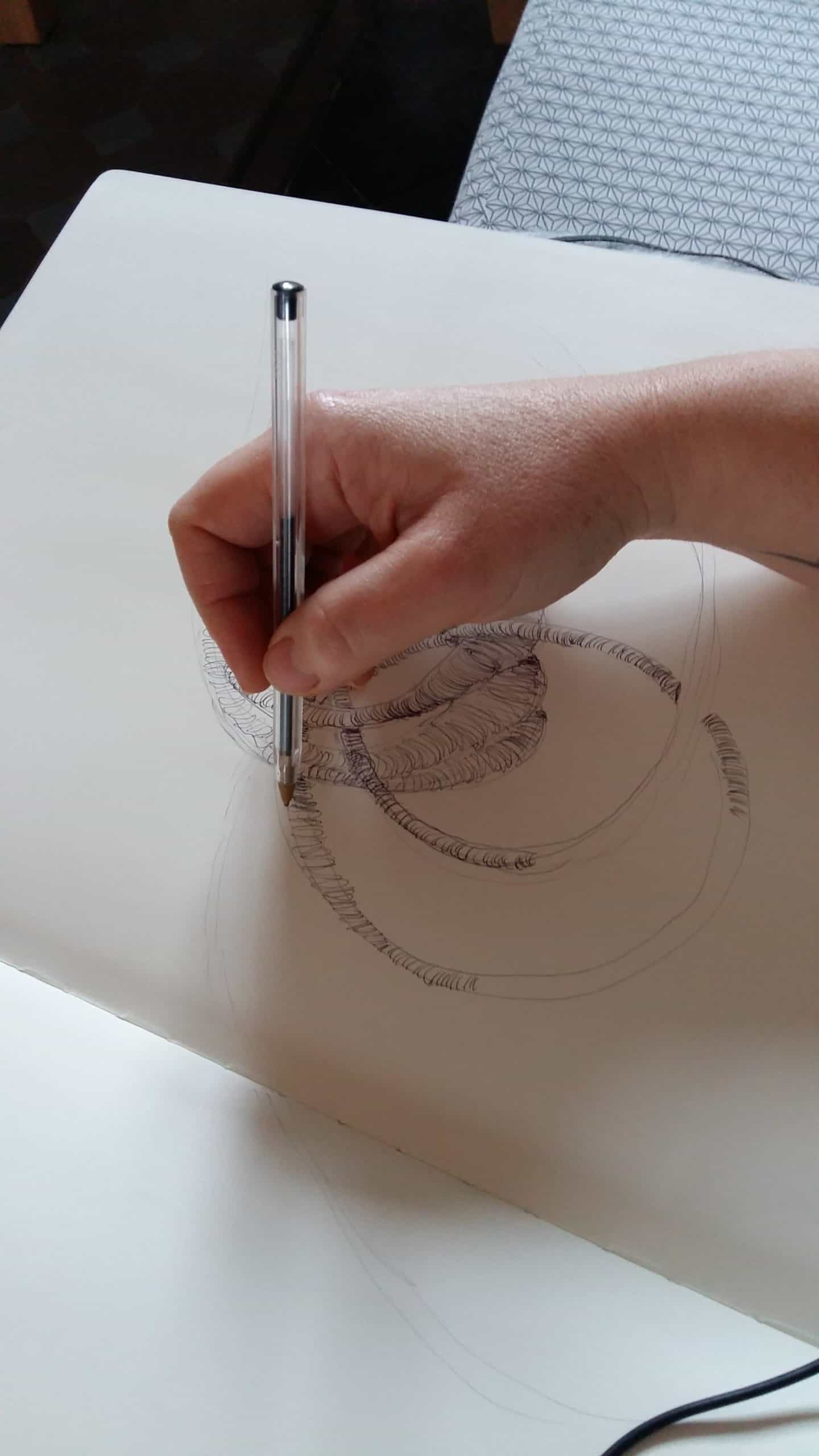 ballpen drawing of a sculpture by Aude Franjou with artist's hand