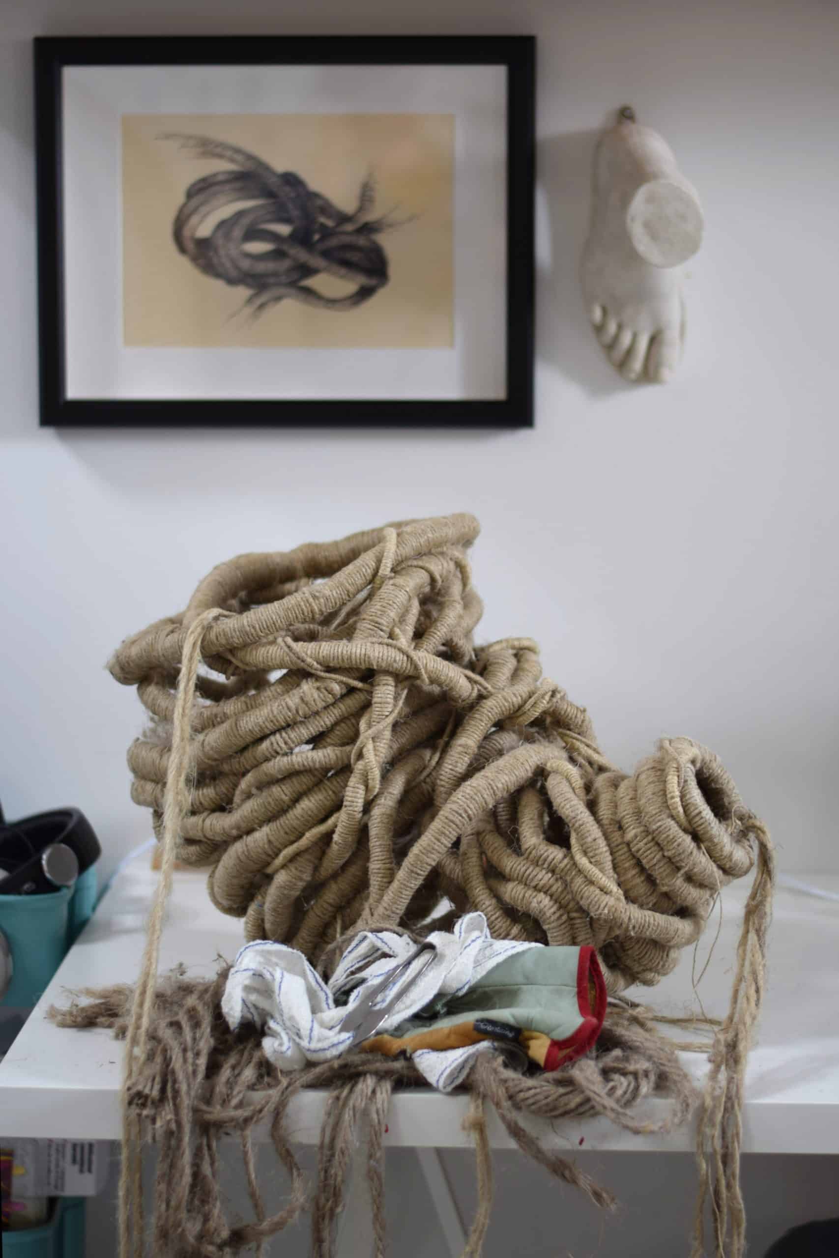 An unfinished scupture sitting on a table in fibre sculptor Aude Franjou's workshop