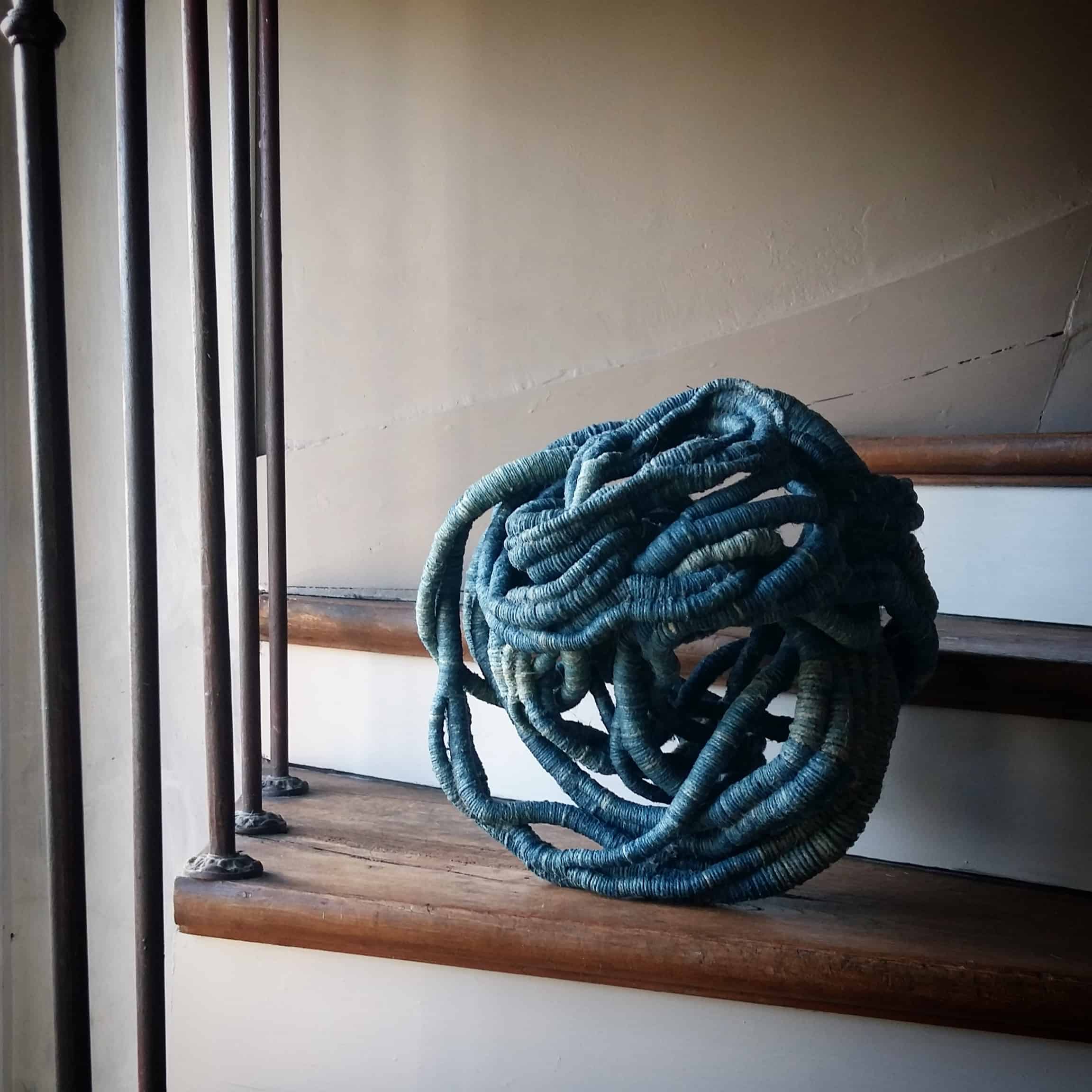 Turquoise blue sculpture by Aude Franjou in the stairs leading to the workshop