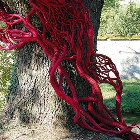 red sculpture on tree