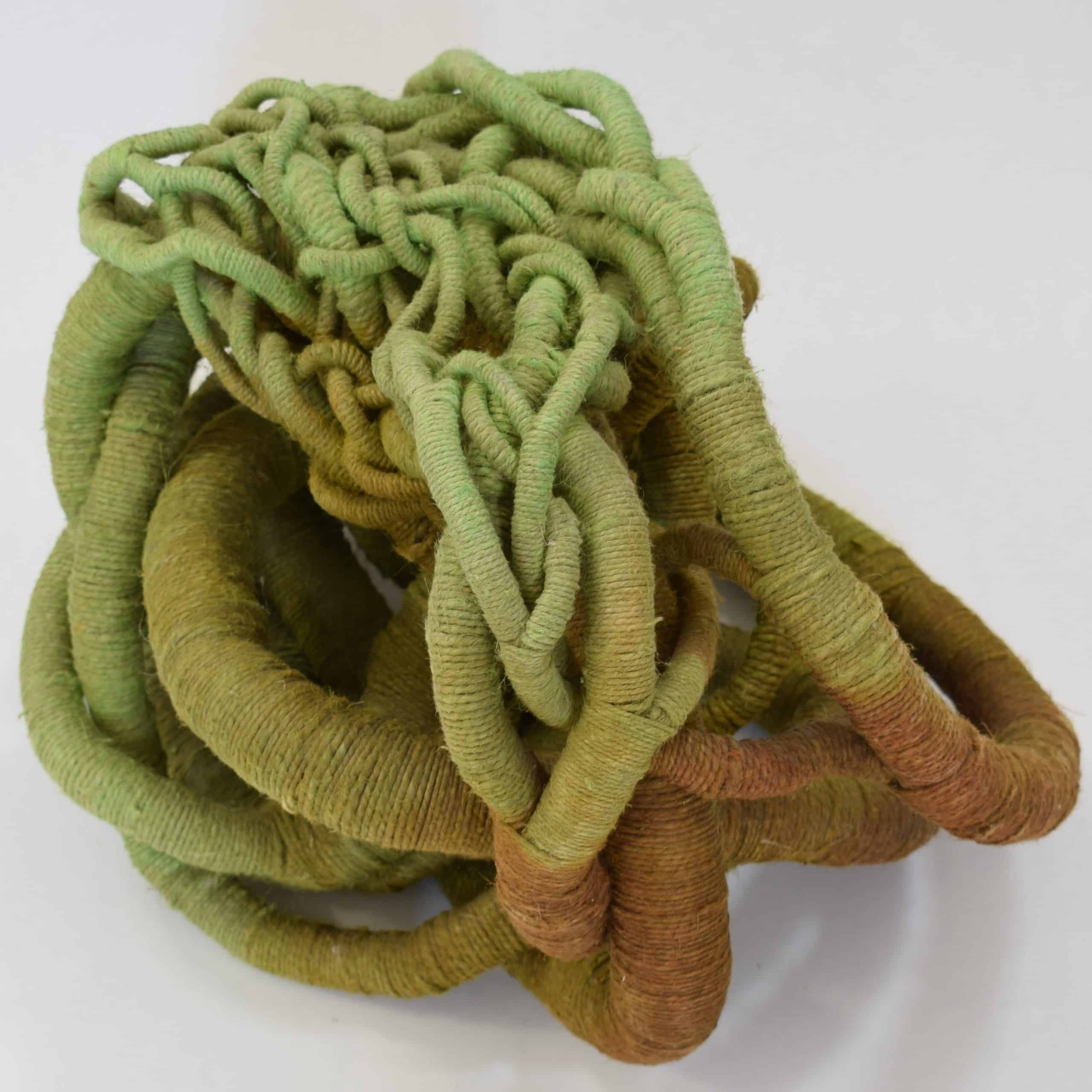 Picture of a green, ocre and yellow linen sculpture by Aude Franjou