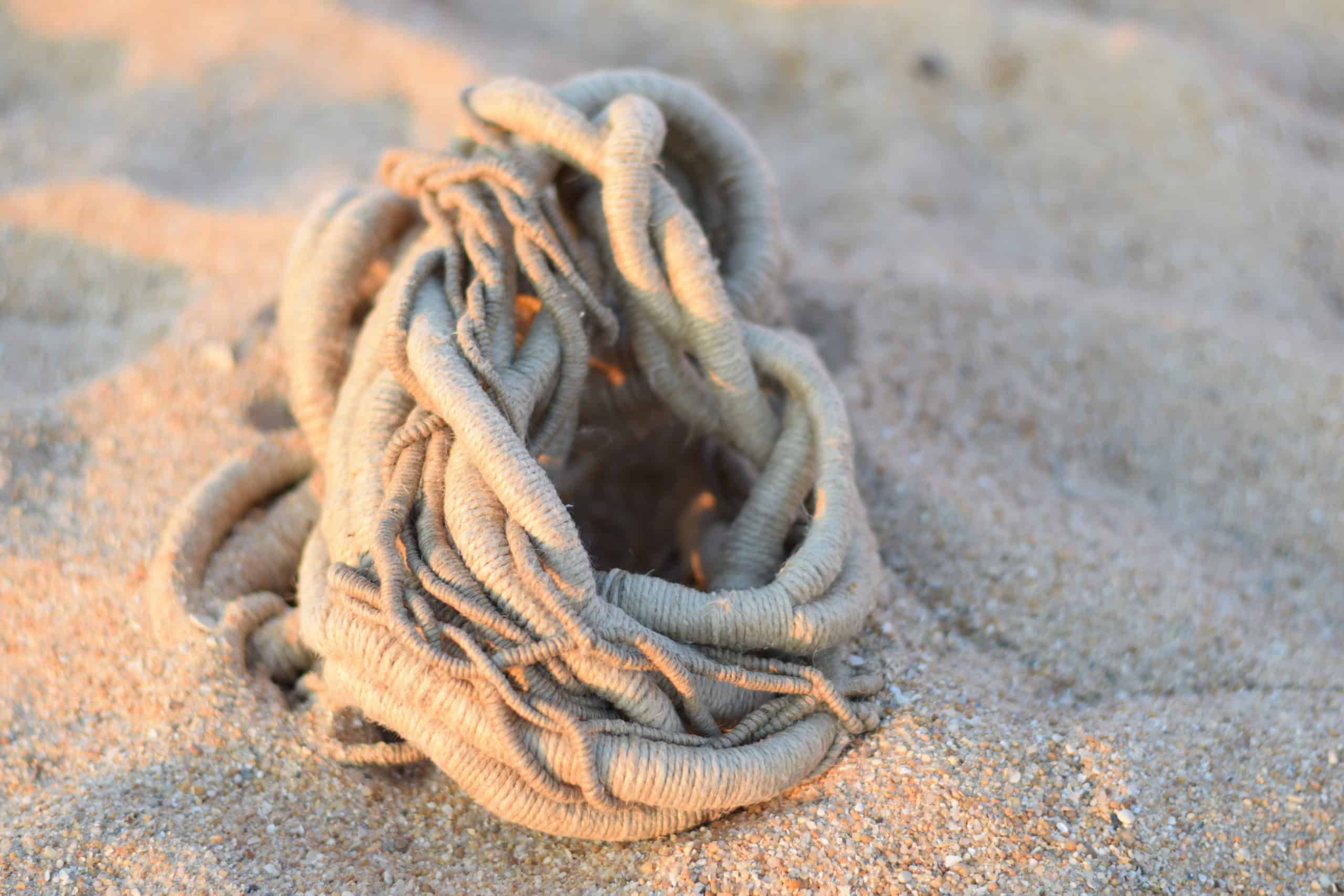 linen sculpture on warm sand by Aude Franjou