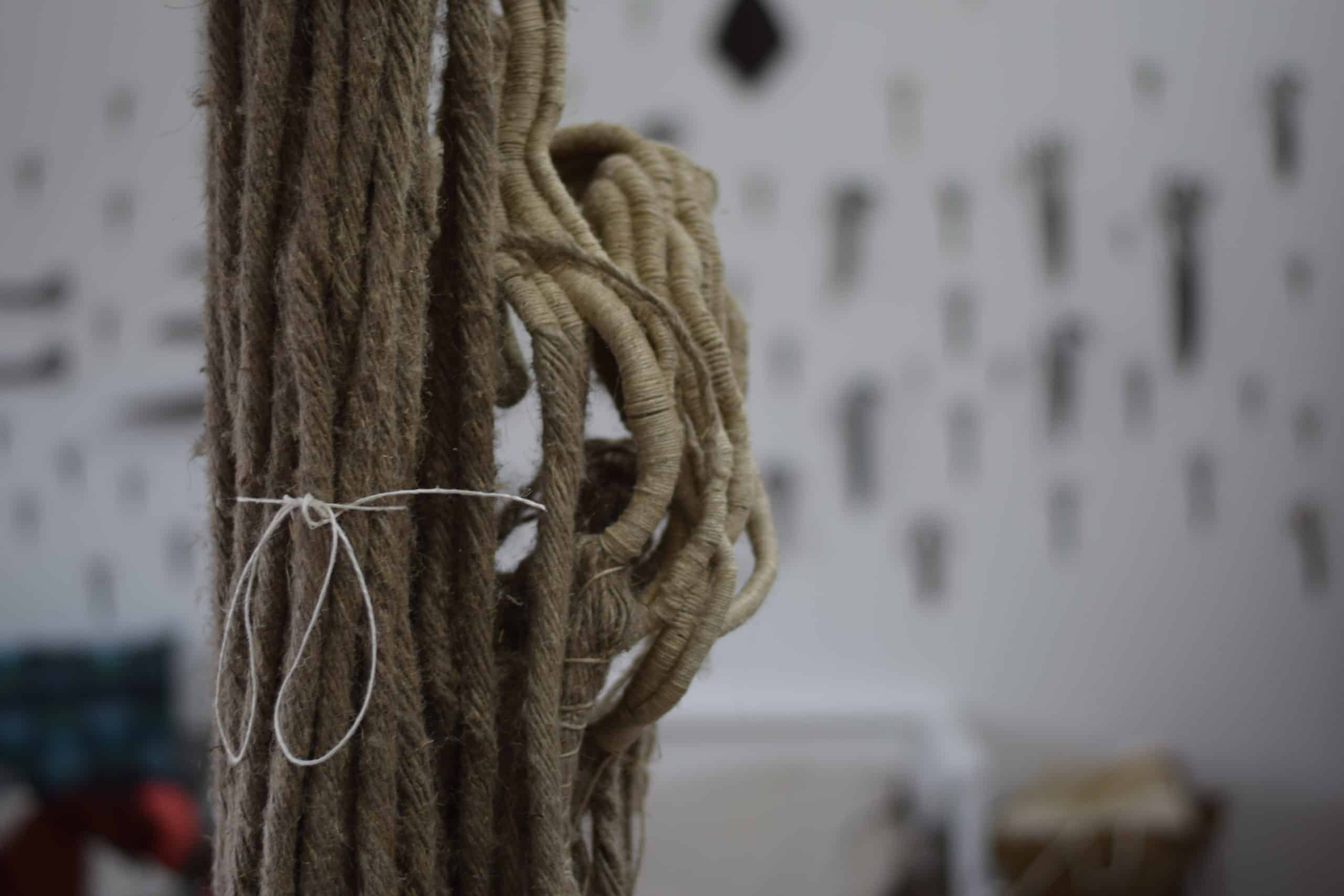 Picture of linen ropes and a sculpture being made out of them