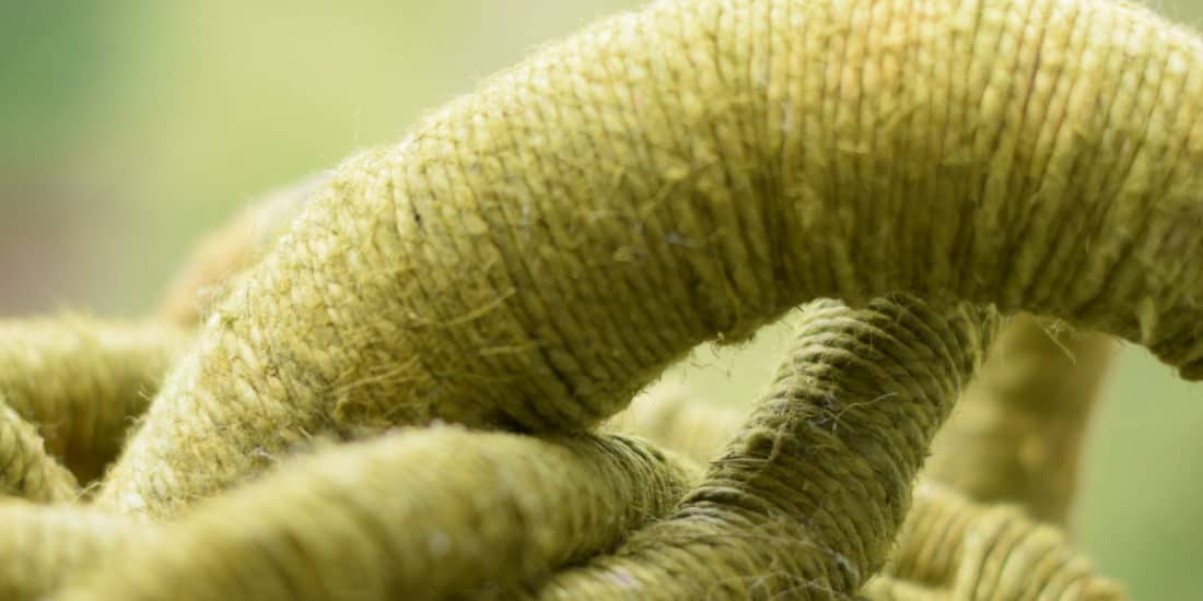 Close-up picture, detail of the texture of a green linen sculpture by Aude Franjou