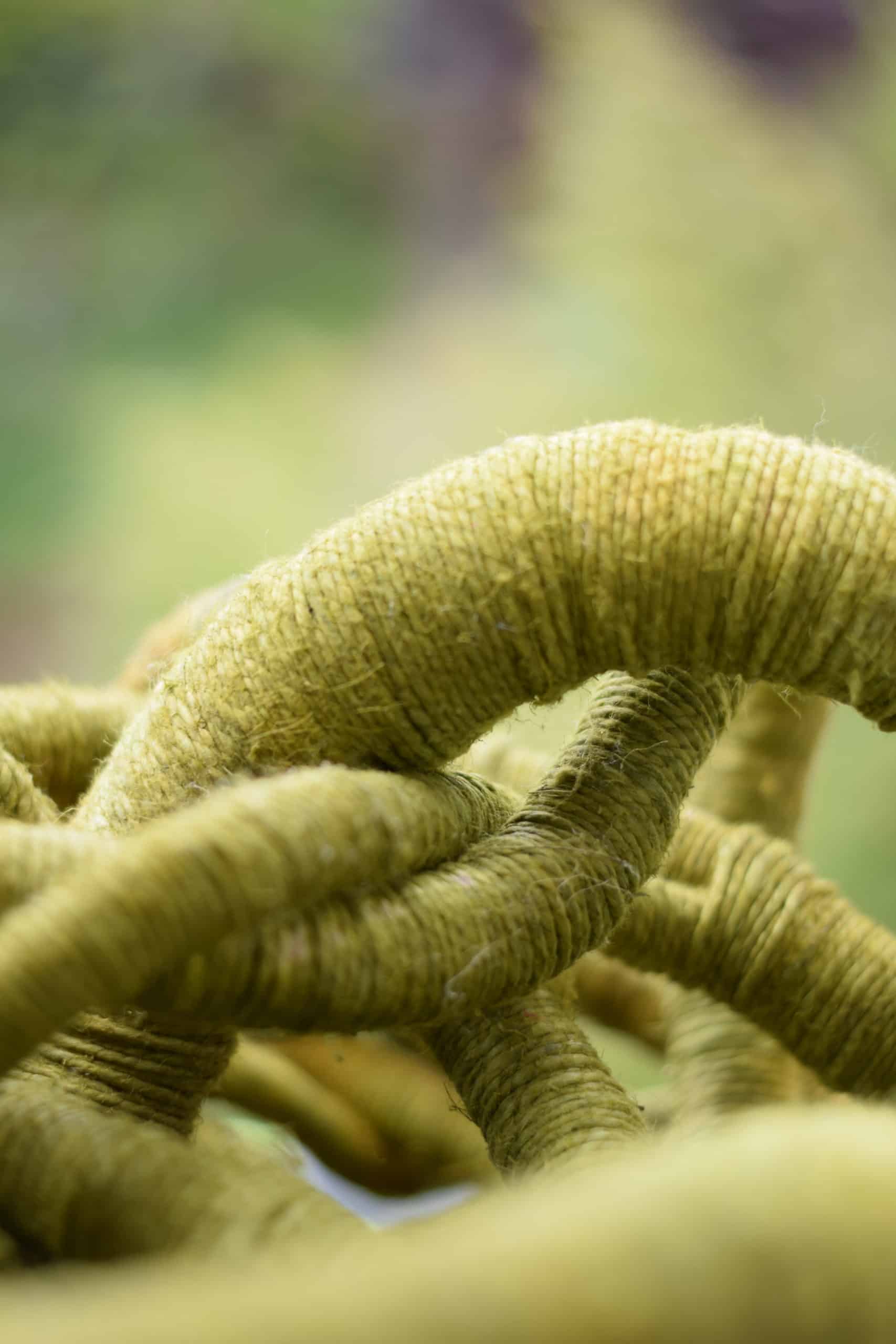 Close-up picture, detail of the texture of a green linen sculpture by Aude Franjou