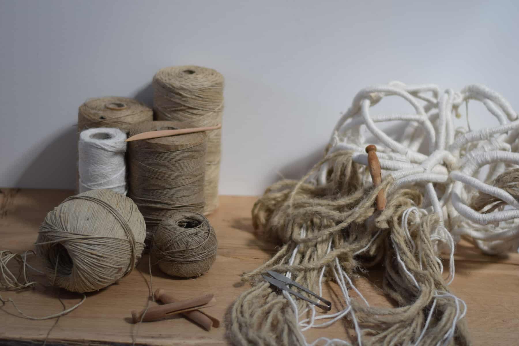 linen rope and strings being sculpted