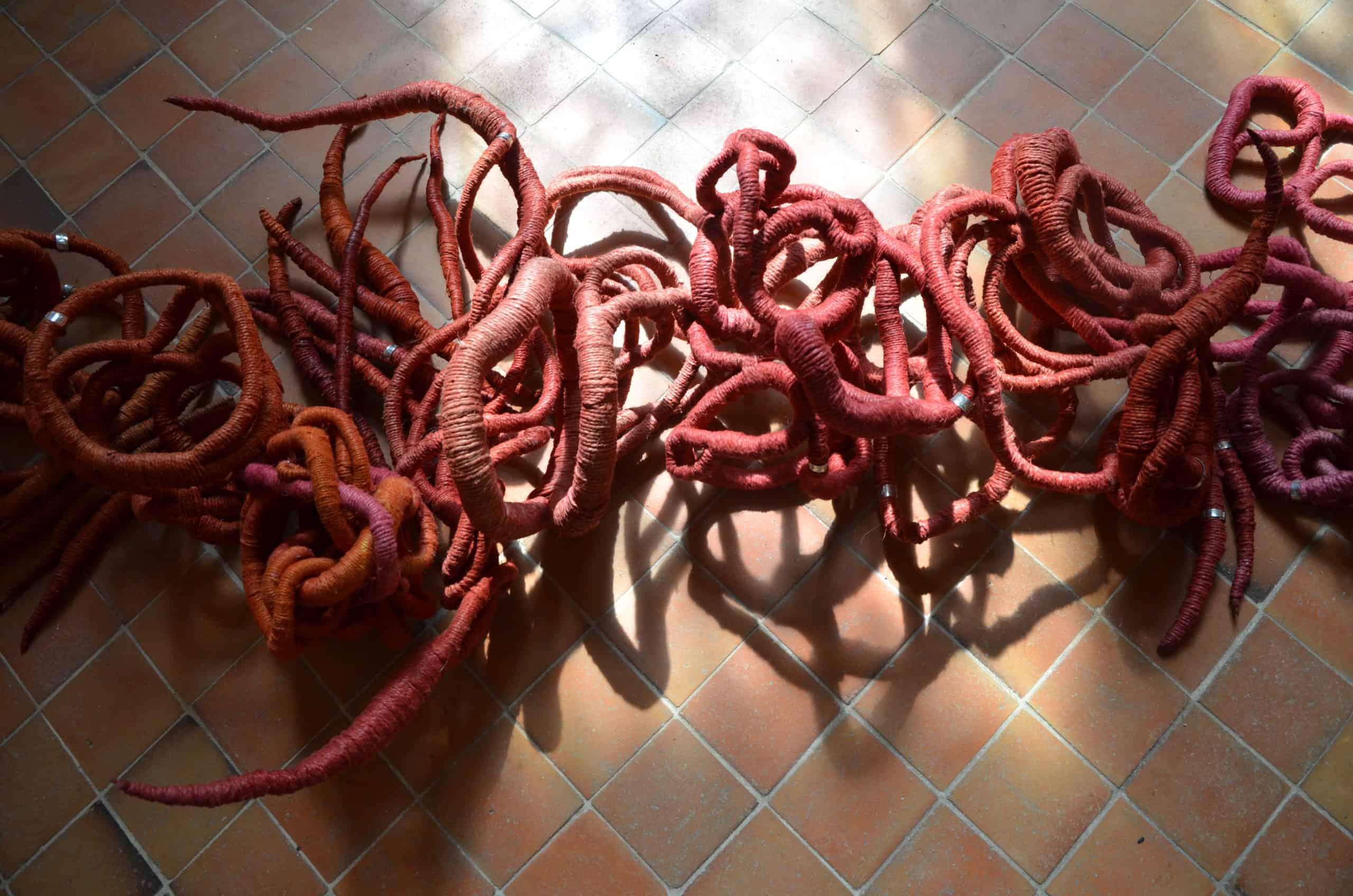 red sculptures by Aude Franjou, exhibition in Chapel in Vivoin, France