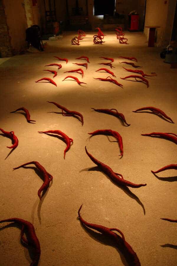 array of small red modern sculptures by Aude Franjou,, textile museum in Chollet, France